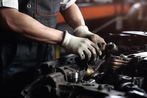 Auto mechanic working on car broken engine in mechanics service or garage. Transport maintenance wrench detia. photo