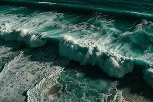 Aerial view of waves crashing against the rocks in the ocean. photo