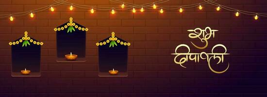 Happy Diwali text in Hindi language with illustration of illuminated oil lamps on brown brick wall background. Website header or banner design. vector