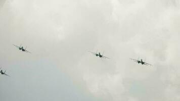 Supersonic fighter jets team in formation flying down. Military aviation. Russian jet military aircraft Flanker E at airshow. Fighting falcon video