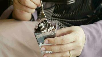 Woman eating chocolate cakes parfait video