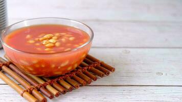 Tasty baked beans in a bowl on table video