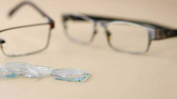 Eyeglass with broken glass on table video