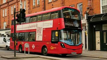 Famous Red Double Decker Bus in the center of the city London - January, 2023. Double-decker buses are in common use throughout the United Kingdom. photo