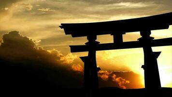 Japanese torii gate with beautiful sunset as background. video