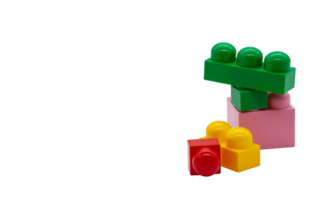 Children's toy construction Lego in different sizes. Red, pink, yellow and green blocks. Picture in high quality. Isolated. PNG