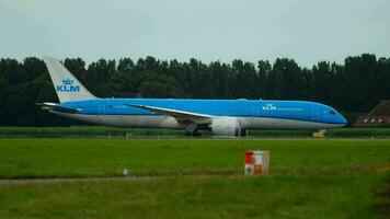 AMSTERDAM, THE NETHERLANDS JULY 24, 2017 - KLM Boeing 787 Dreamliner PH BHI taxiing and Air Astana Airbus 321 accelerate before departure at RW 36L Polderbaan. Shiphol Airport, Amsterdam, Holland video