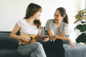 Two young adult woman living together with relationship relax lifestyle at home photo