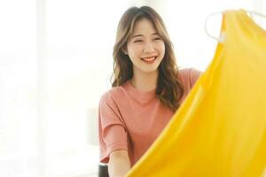 Portrait of young adult southeast asian dyed hair woman with yellow shirt photo