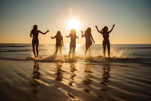 Young group of people jumping into the air at beach. photo