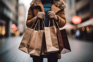 Woman with shopping bags walking on street. photo