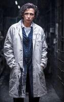 scientist researcher wearing ripped lab coat at laboratory, photo