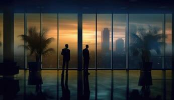 A blurred image of business people in an office, silhouette figures. photo