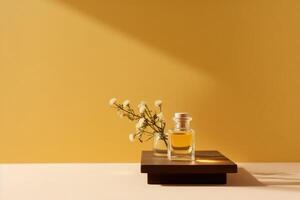 A glass container of essential oil on a yellow table. Mockup. photo