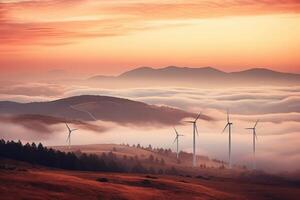 Wind turbines in the mountains at sunset. photo