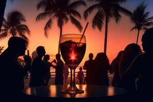 palm tree and drinks in glasses on beach silhouette sunset. selective focus. photo