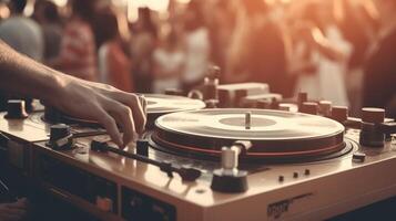 Dj playing music on a turntable in front of a crowd at festival, closeup photo. photo