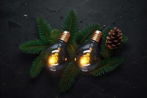 Christmas decoration, christmas lights with fir branches on a black textured background. photo