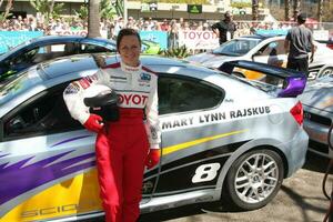 Mary Lynn Rajskub with her car at the Toyota ProCeleb Qualifying Day on April 17 2009 at the Long Beach Grand Prix course in Long Beach California 2009 Kathy Hutchins Hutchins Photo