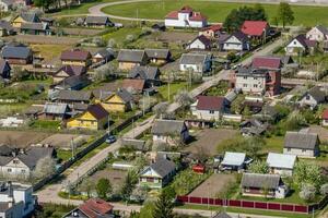 panoramic aerial view of private development with country houses or village photo