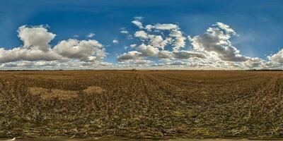 spherical 360 hdri panorama among farming field with clouds on blue sky in equirectangular seamless projection, use as sky replacement in drone panoramas, game development as sky dome or VR content photo