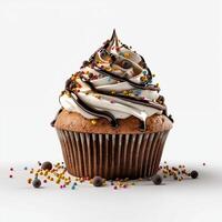 A cupcake with chocolate icing and sprinkles on it photo