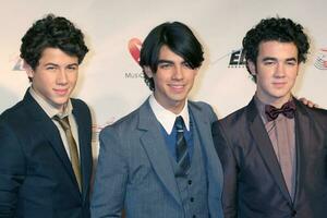 Jonas Brothers arriving at Music Cares Man of the Year Dinner honoring Neil Diamond at the Los Angeles Convention Center in Los Angeles CA on February 6 2009 2009 Kathy Hutchins Hutchins Photo