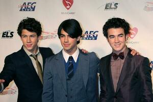 Jonas Brothers arriving at Music Cares Man of the Year Dinner honoring Neil Diamond at the Los Angeles Convention Center in Los Angeles CA on February 6 2009 2009 Kathy Hutchins Hutchins Photo