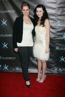 LOS ANGELES - DEC 14, Jane Carrey, Jillian Clare attends the Miss Behave Season Two Premiere Party at Flappers Comedy Club on December 14, 2010 in Burbank, CA photo