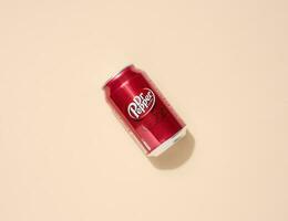 Mykolaiv, Ukraine May 6, 2023 Metal can of Dr. Pepper drink on a beige background, top view photo