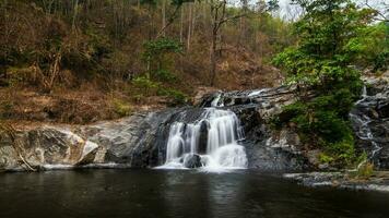 Khlong Nam Lai Waterfall, Beautiful waterfalls in klong Lan national park of Thailand photo