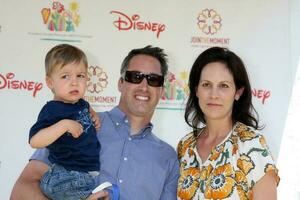 Annabeth Gish and husband and son arriving at A Time For Heroes Celebrity Carnival benefiting the Elizabeth Glaser Pediatrics AIDS Foundation at the Wadsworth Theater Grounds in Westwood , CA on June 7, 2009 photo