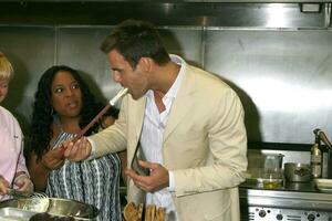 Sherri Shepherd and Cameron Mathison in the Wolfgang Puck Catering kitchen demonstrating and trying the deserts for the Daytime Emmy dinner adjacent to the Kodak Theater piror to Daytime Emmys at the Kodak Theater in Hollywood, CA June 19, 2008 photo