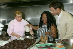 Sherri Shepherd and Cameron Mathison in the Wolfgang Puck Catering kitchen demonstrating and trying the deserts for the Daytime Emmy dinner adjacent to the Kodak Theater piror to Daytime Emmys at the Kodak Theater in Hollywood, CA June 19, 2008 photo