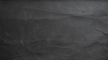 Dark grey black slate background or texture. Black and white stone wall photo