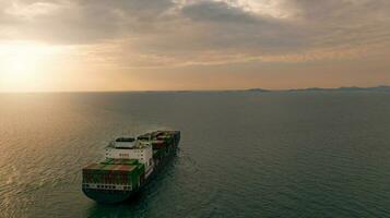 Aerial view of a container cargo ship on the sea. Cargo and shipping logistics business. Export and import container ship. International container shipping. Maritime transport. Freight transportation. photo