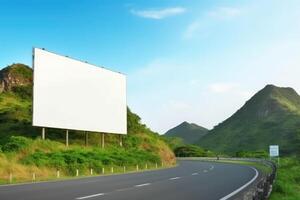 Blank billboard on the road during sunny day. photo