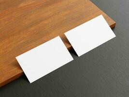 Clean minimal business card mockup on wood background photo
