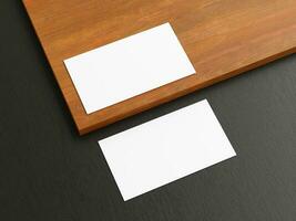 Clean minimal business card mockup on wood background photo