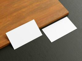 Clean minimal business card mockup on wood background photo
