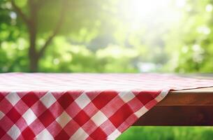 . Empty picnic table with defocused lush foliage background photo