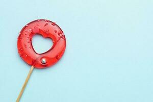 Heart Shape Candy On blue Background. photo