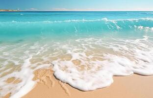 . Ocean wave on the sandy beach photo