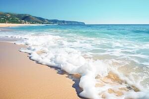 . Ocean wave on the sandy beach photo
