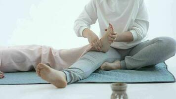 Hand making thai feet massage. Alternative medicine and thai massage concept video