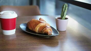 Blank take away kraft coffee cup on table , video