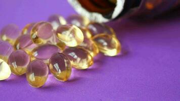 Fish oil capsules vitamin D in a glass bottle video
