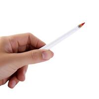 White pencil in woman's hand. White background. photo
