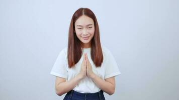 Happy asian girl laughing and smiling expressing gratitude, namaste gesture, thank you. video