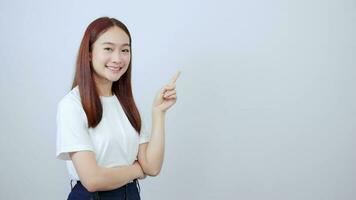 Cute Asian girl pointing signboard on white background text video